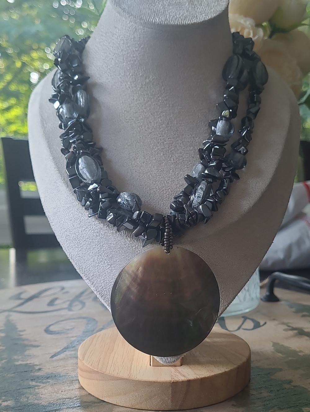 Multi-Strand Black Bead Necklace with Large Round Shell  Pendant